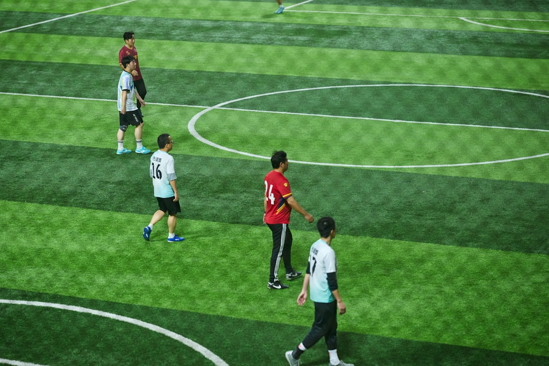 soccer-players-on-a-green-field-during-a-game-rziwxx5toca
